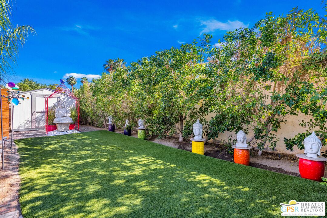 68401 Rodeo Road Cathedral City, CA 92234 - Photo 37 of 46 a front view of a house with swing and a garage