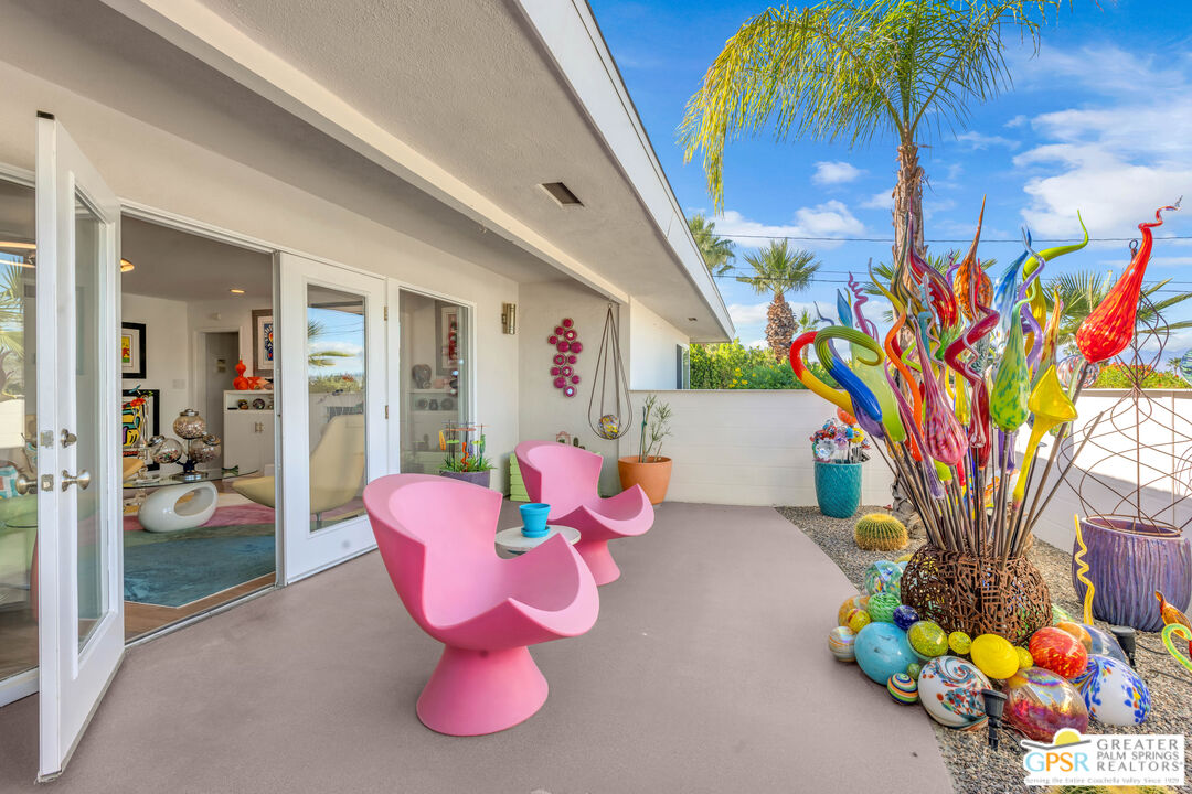 68401 Rodeo Road Cathedral City, CA 92234 - Photo 5 of 46 a bathroom with a sink mirror and painting on the wall