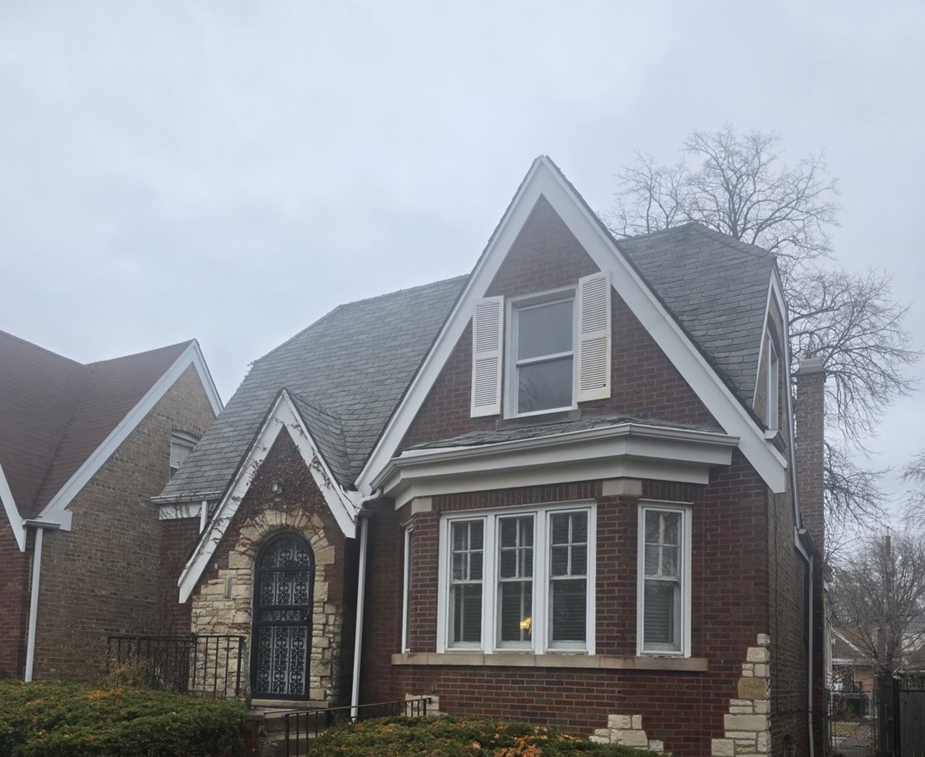 8411 South Indiana Avenue Chicago, IL 60619 - Photo 2 of 7 a front view of a house with a yard