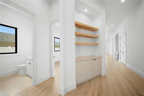 a view of a bathroom with wooden floor