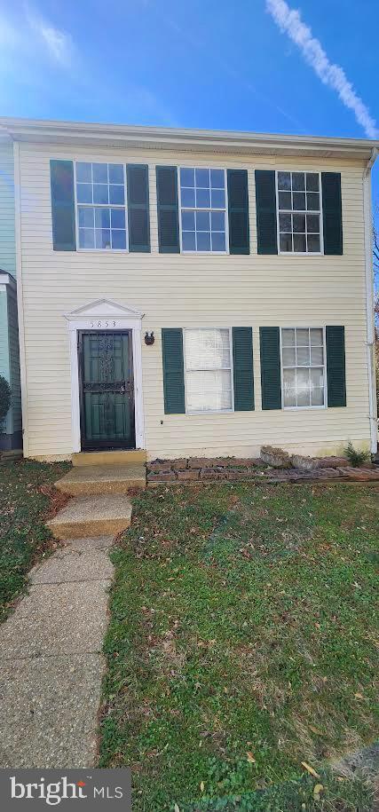 5853 Suitland Road Suitland, MD 20746 - Photo 1 of 2 a front view of a house with a yard