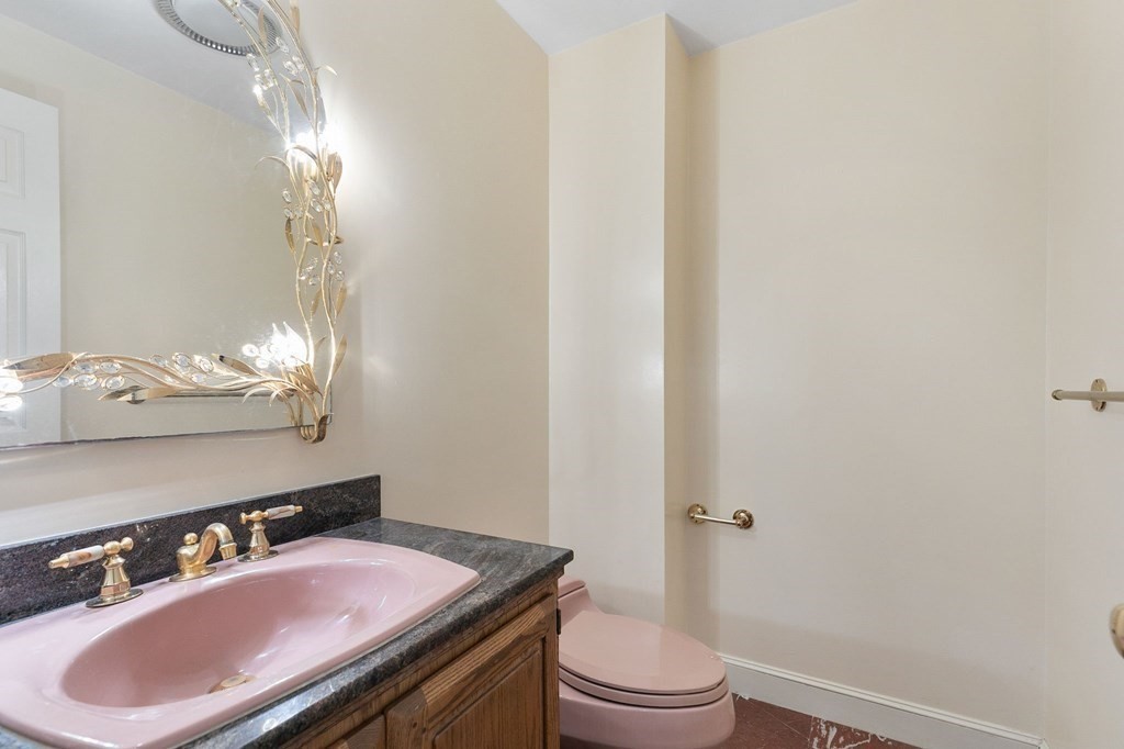 1 Sutton Place Weston, MA 02493 - Photo 12 of 33 a bathroom with a sink a toilet and mirror