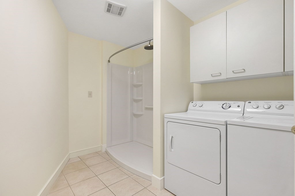 1 Sutton Place Weston, MA 02493 - Photo 13 of 33 a utility room with dryer and washer