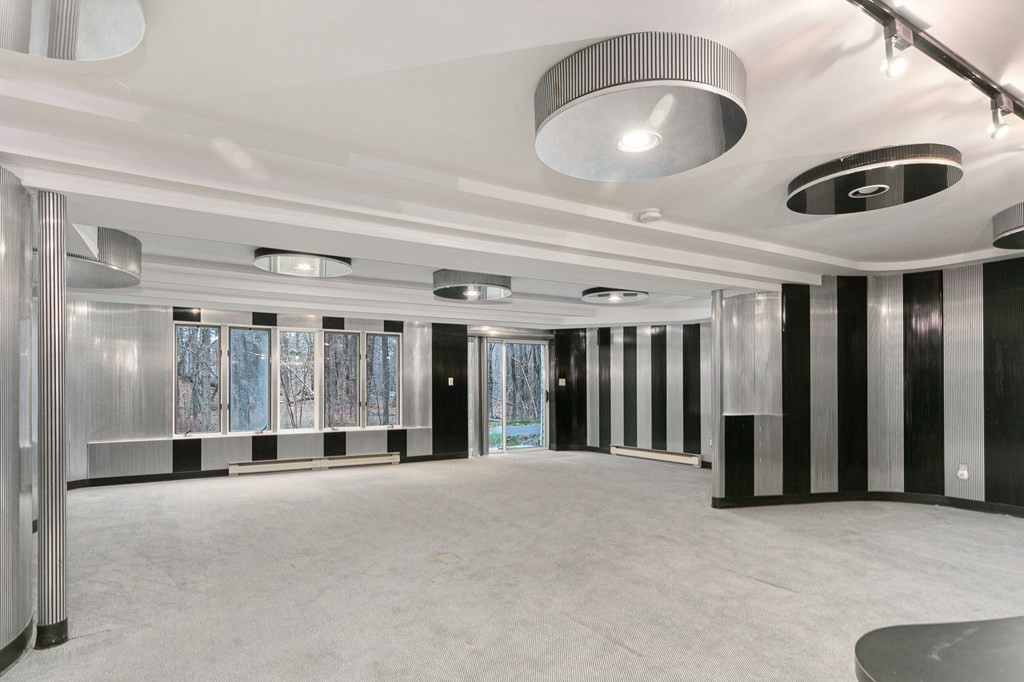 1 Sutton Place Weston, MA 02493 - Photo 26 of 33 an entryway with a ceiling fan