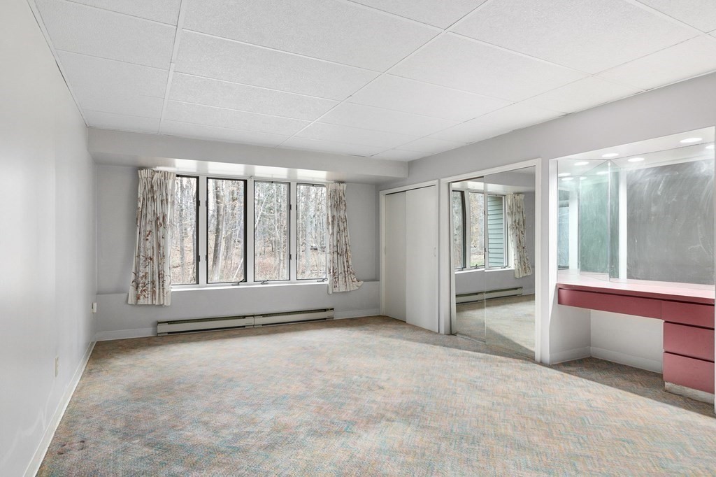 1 Sutton Place Weston, MA 02493 - Photo 27 of 33 an empty room with windows and view