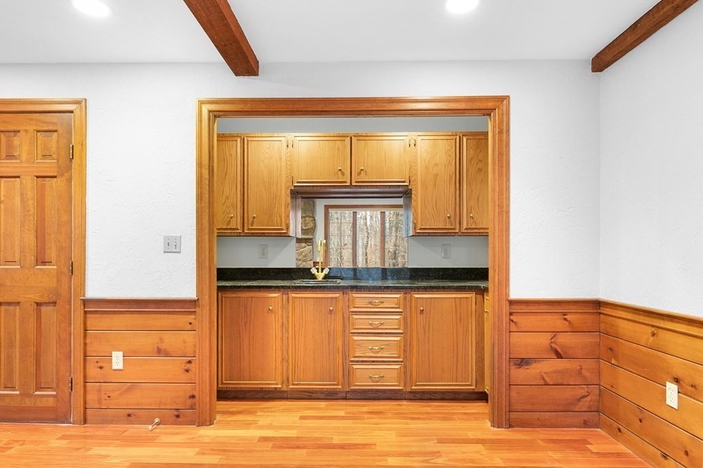 1 Sutton Place Weston, MA 02493 - Photo 10 of 33 a bathroom with a granite countertop sink and a mirror