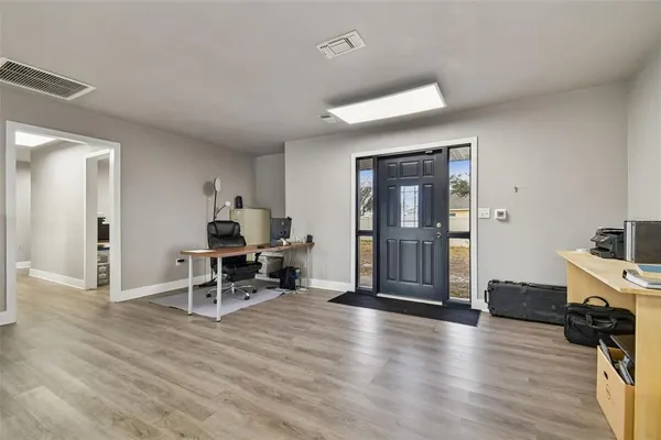 a view of workspace with wooden floor