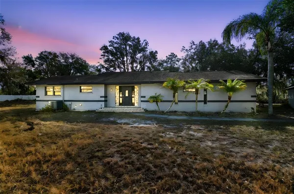 a view of outdoor space with garden and trees