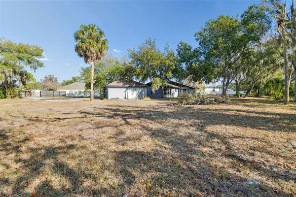 a view of a lake with lawn chairs