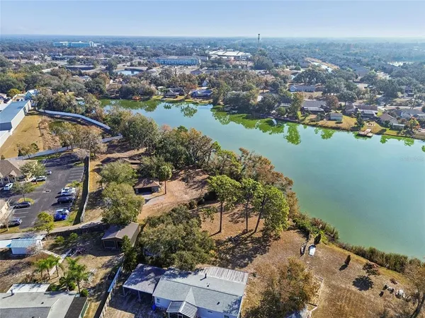 an aerial view of a city with lake view