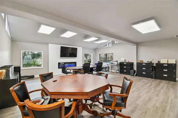 a view of a dining room with furniture and wooden floor