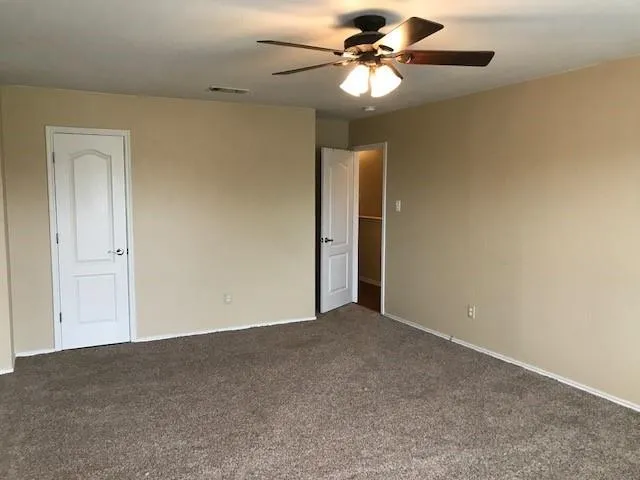 a view of a big room with carpet
