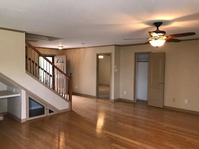 a view of an entryway with wooden floor