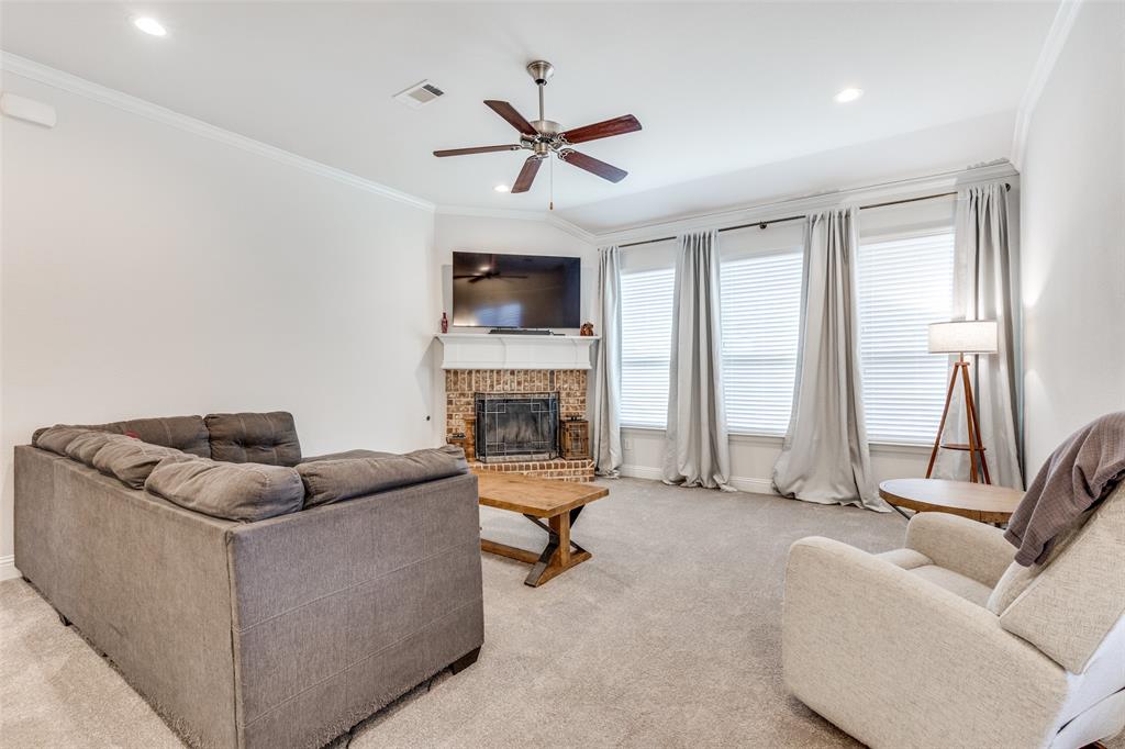 1173 Roping Reins Way Fort Worth, TX 76052 - Photo 12 of 24 Living area featuring a ceiling fan, ornamental molding, light carpet, a fireplace, and recessed lighting