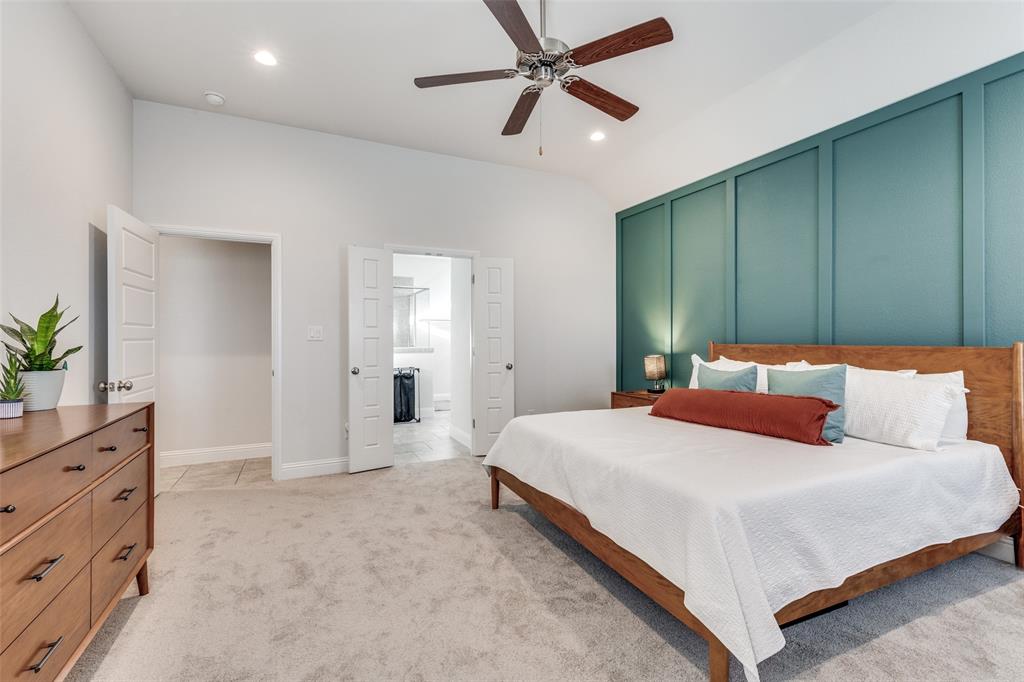 1173 Roping Reins Way Fort Worth, TX 76052 - Photo 14 of 24 Bedroom with recessed lighting, connected bathroom, a decorative wall, a ceiling fan, and light carpet