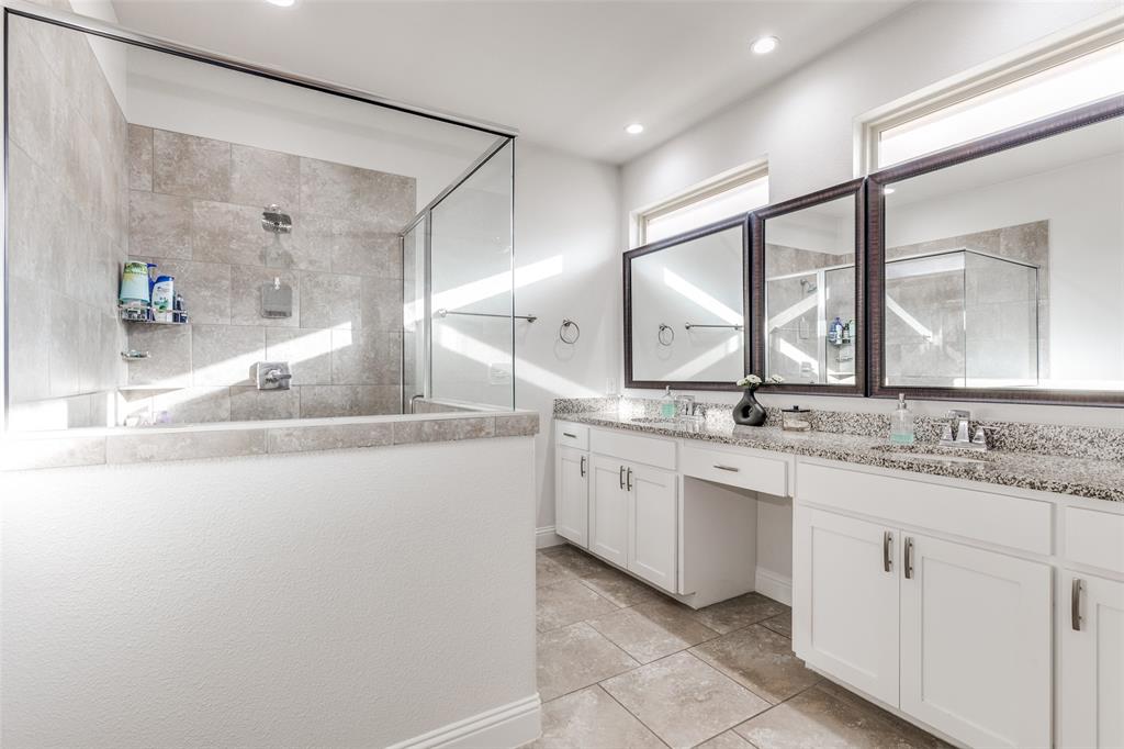 1173 Roping Reins Way Fort Worth, TX 76052 - Photo 15 of 24 primary bath with double vanity and a walk in shower