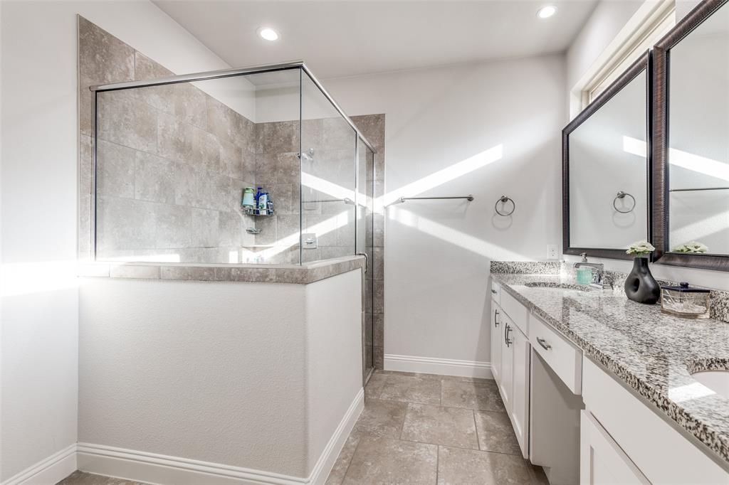 1173 Roping Reins Way Fort Worth, TX 76052 - Photo 16 of 24 Bathroom with tiled shower, double vanity, and recessed lighting