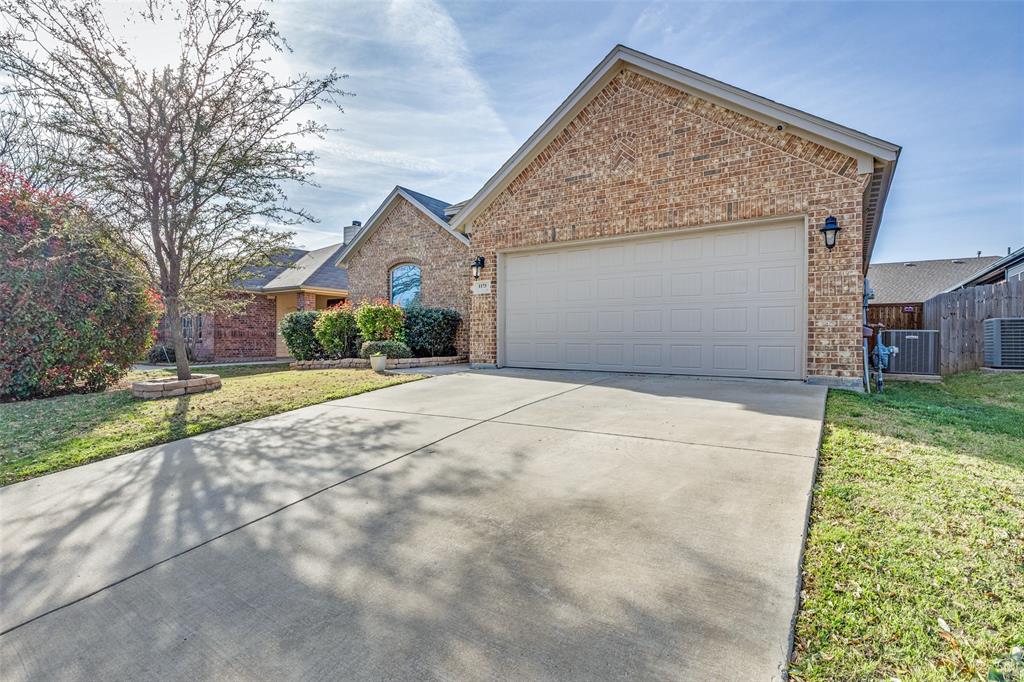 1173 Roping Reins Way Fort Worth, TX 76052 - Photo 2 of 24 View of front of property with concrete driveway, an attached garage, and brick siding
