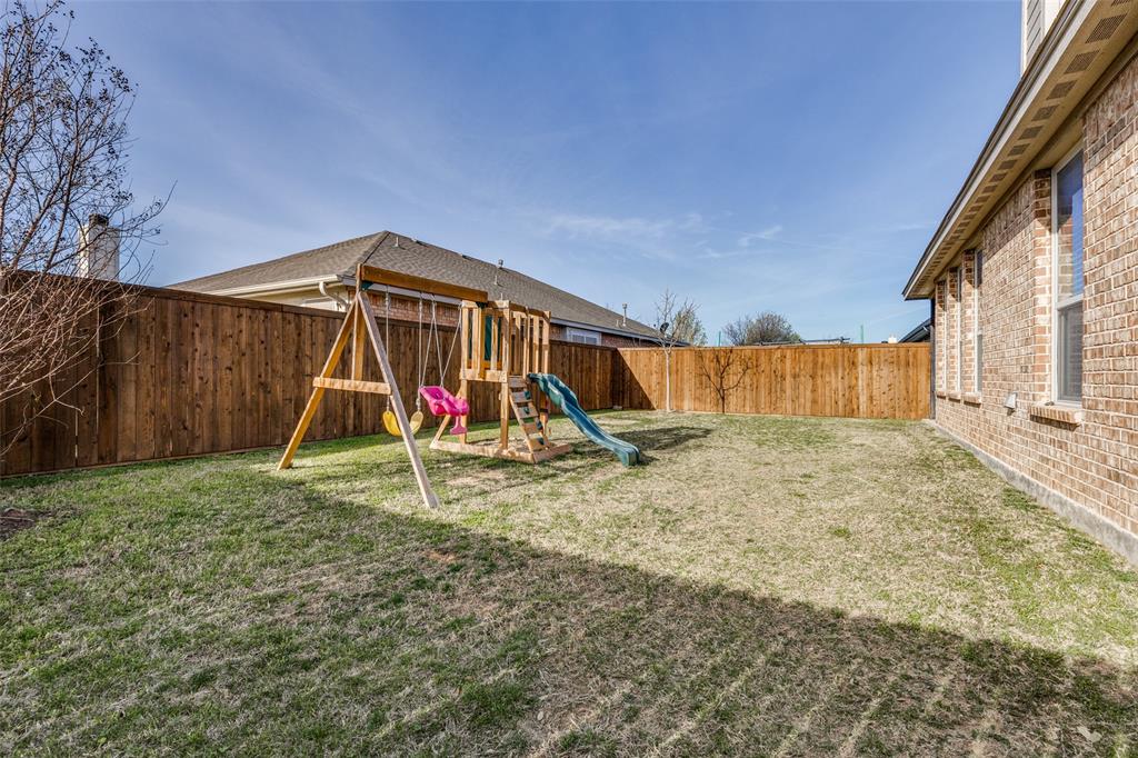 1173 Roping Reins Way Fort Worth, TX 76052 - Photo 23 of 24 Fenced backyard with a playground