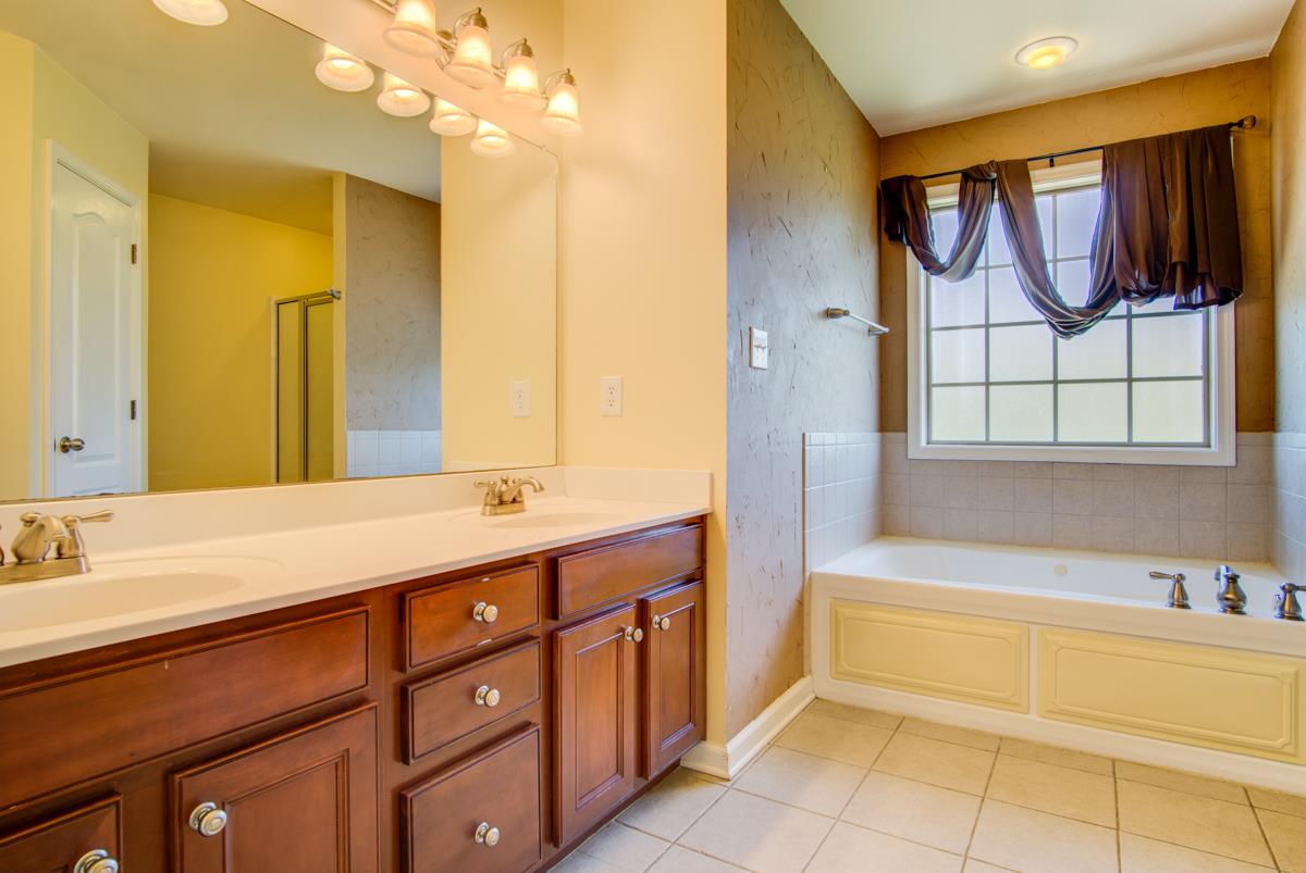 1031 Bluejay Lane Adams, TN 37010 - Photo 11 of 19 Large Master Bath with 2 sinks, large tub, separate shower and private toilet area!