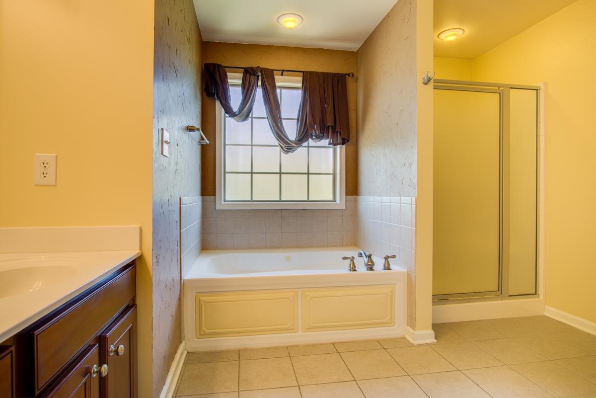 1031 Bluejay Lane Adams, TN 37010 - Photo 12 of 19 Large Master Bath with 2 sinks, large tub, separate shower and private toilet area!