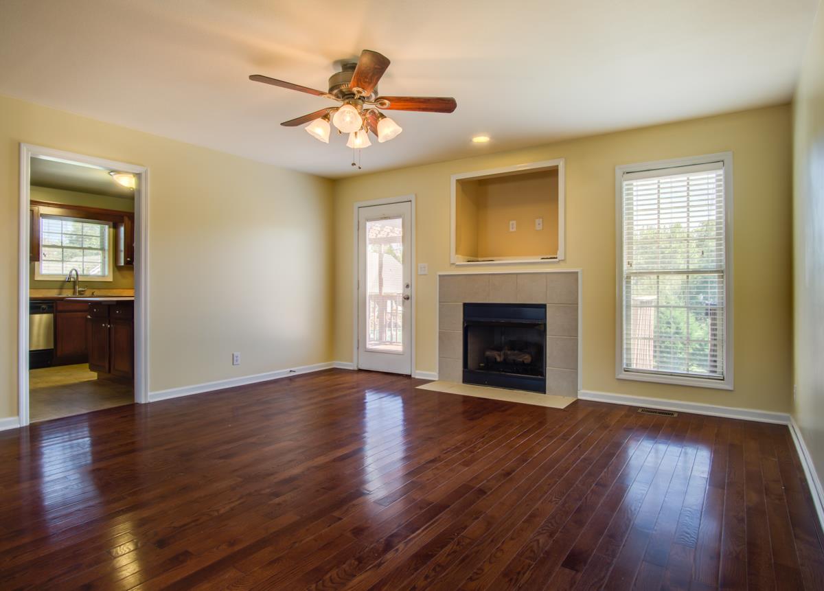 1031 Bluejay Lane Adams, TN 37010 - Photo 4 of 19 Gorgeous hardwood floors. Kitchen right off main living area for great entertaining!