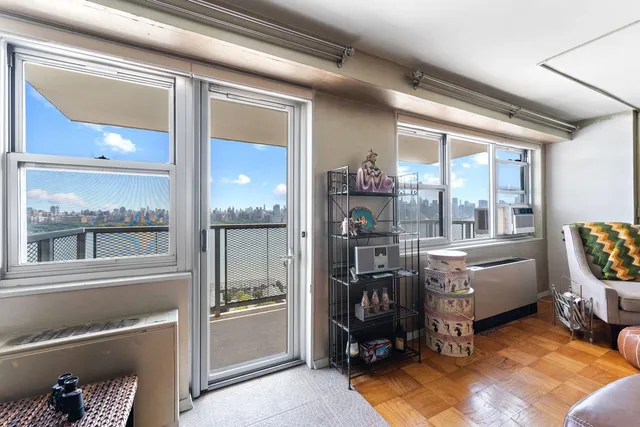 a room with furniture and a large window