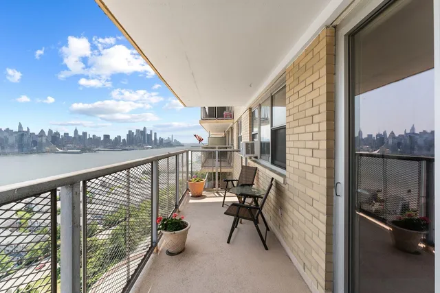 a view of balcony with furniture