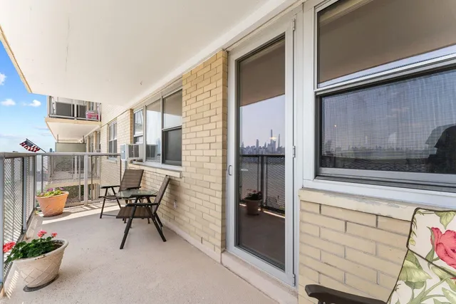 a view of a hallway with seating area