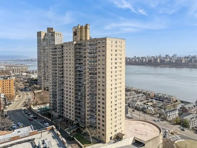 a view of a room with furniture and floor to ceiling window