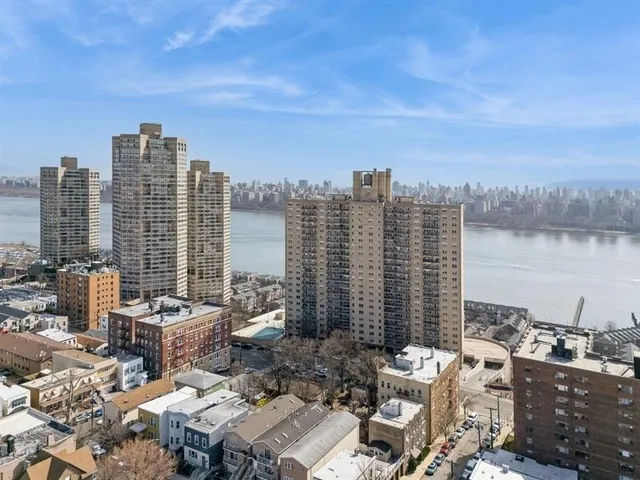 a view of a city with tall buildings in the background