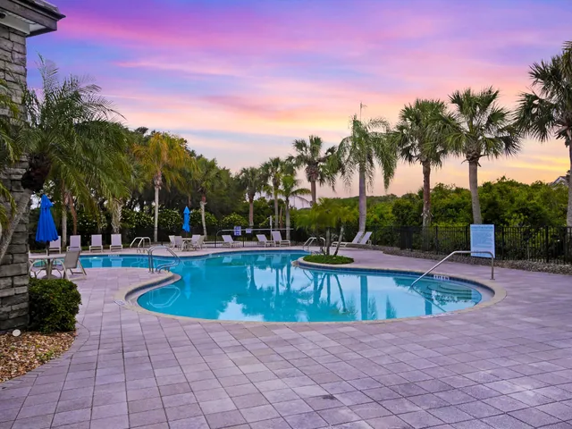 a view of a swimming pool with a patio