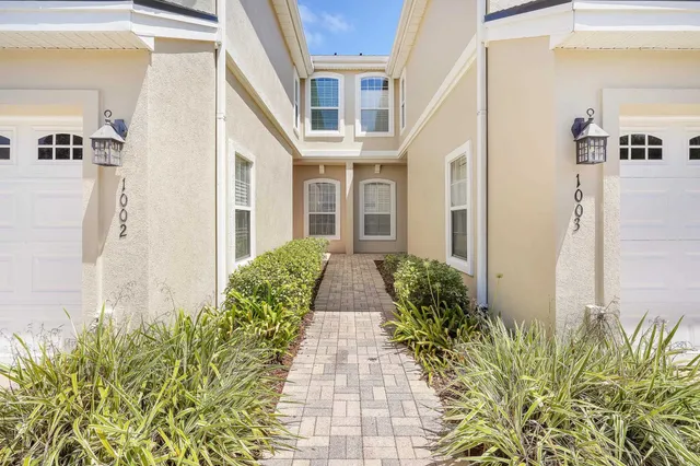 a view of a pathway along with potted plants