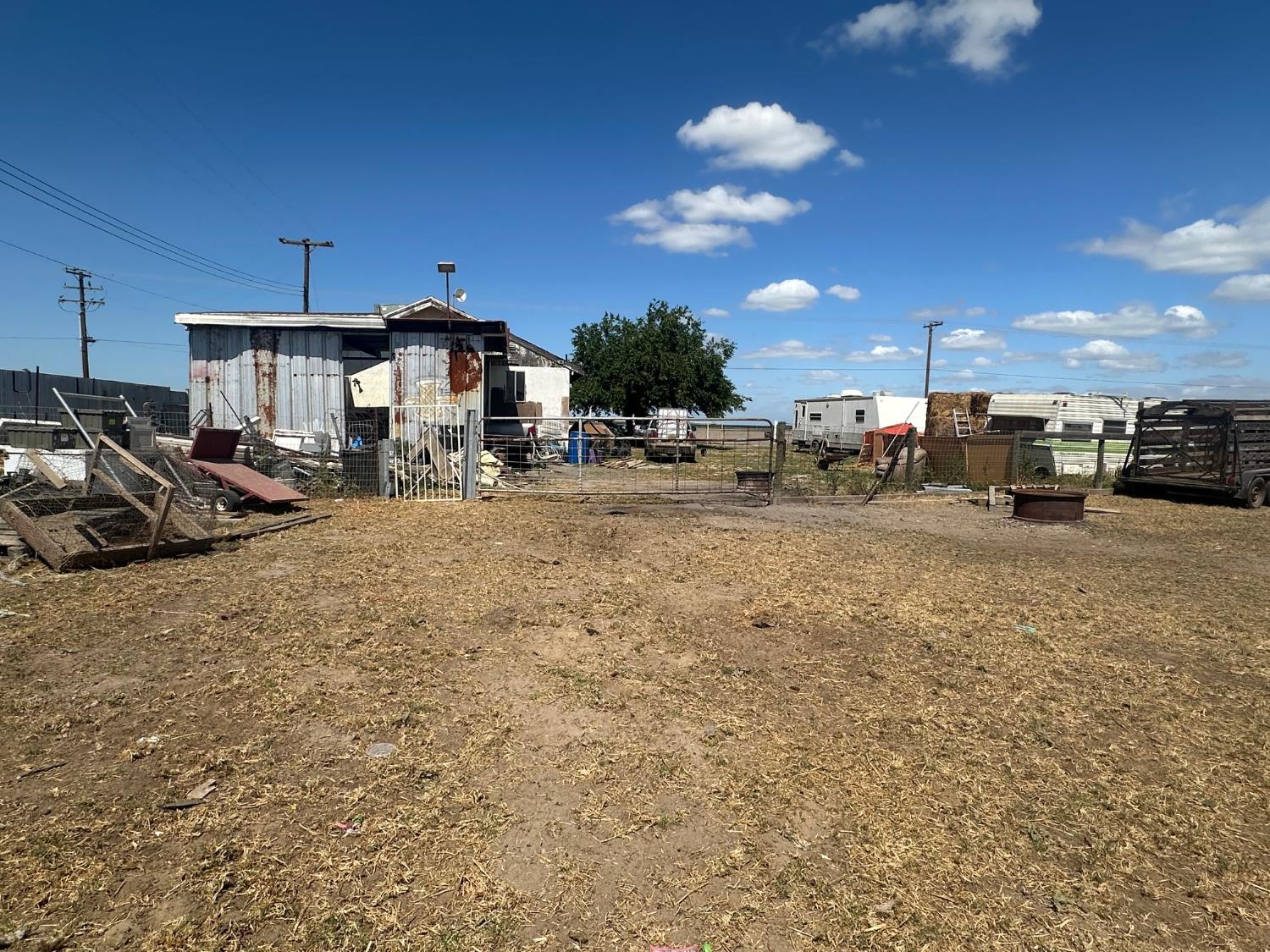 7599 Ave 152 Tipton, CA 93272 - Photo 15 of 17 a view of a road with car parked