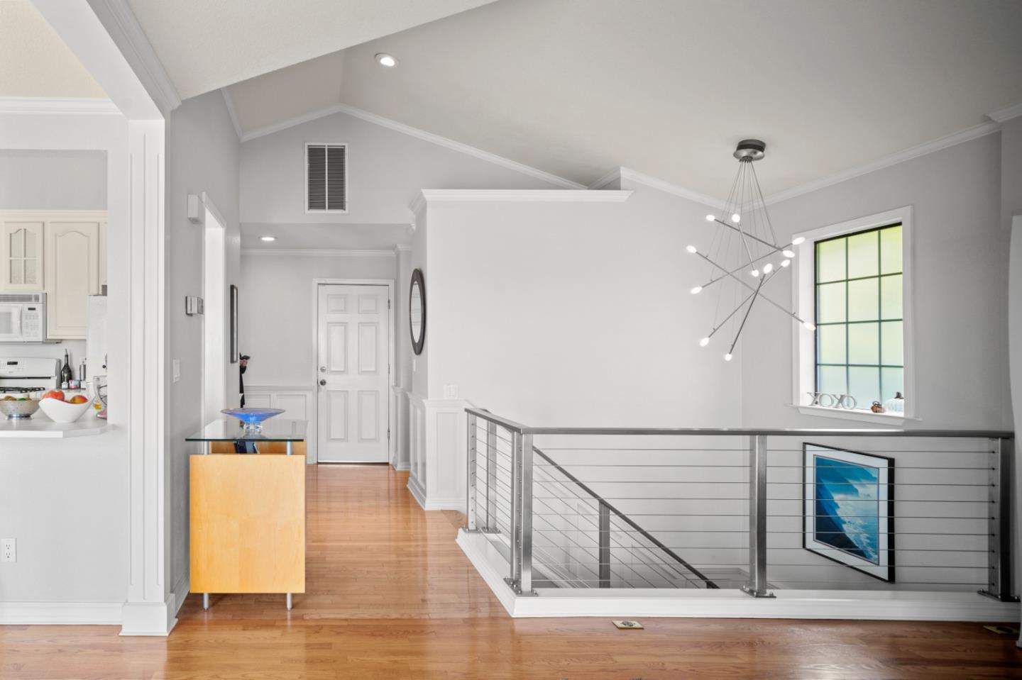 1051 Highlander Drive Seaside, CA 93955 - Photo 19 of 40 a view of a hallway with wooden floor and staircase