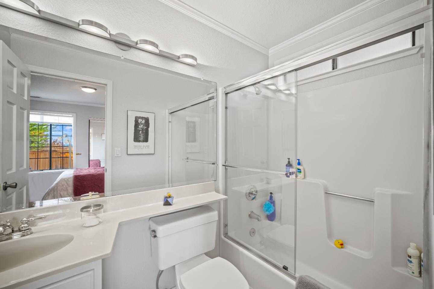 1051 Highlander Drive Seaside, CA 93955 - Photo 31 of 40 a bathroom with a sink vanity mirror and toilet