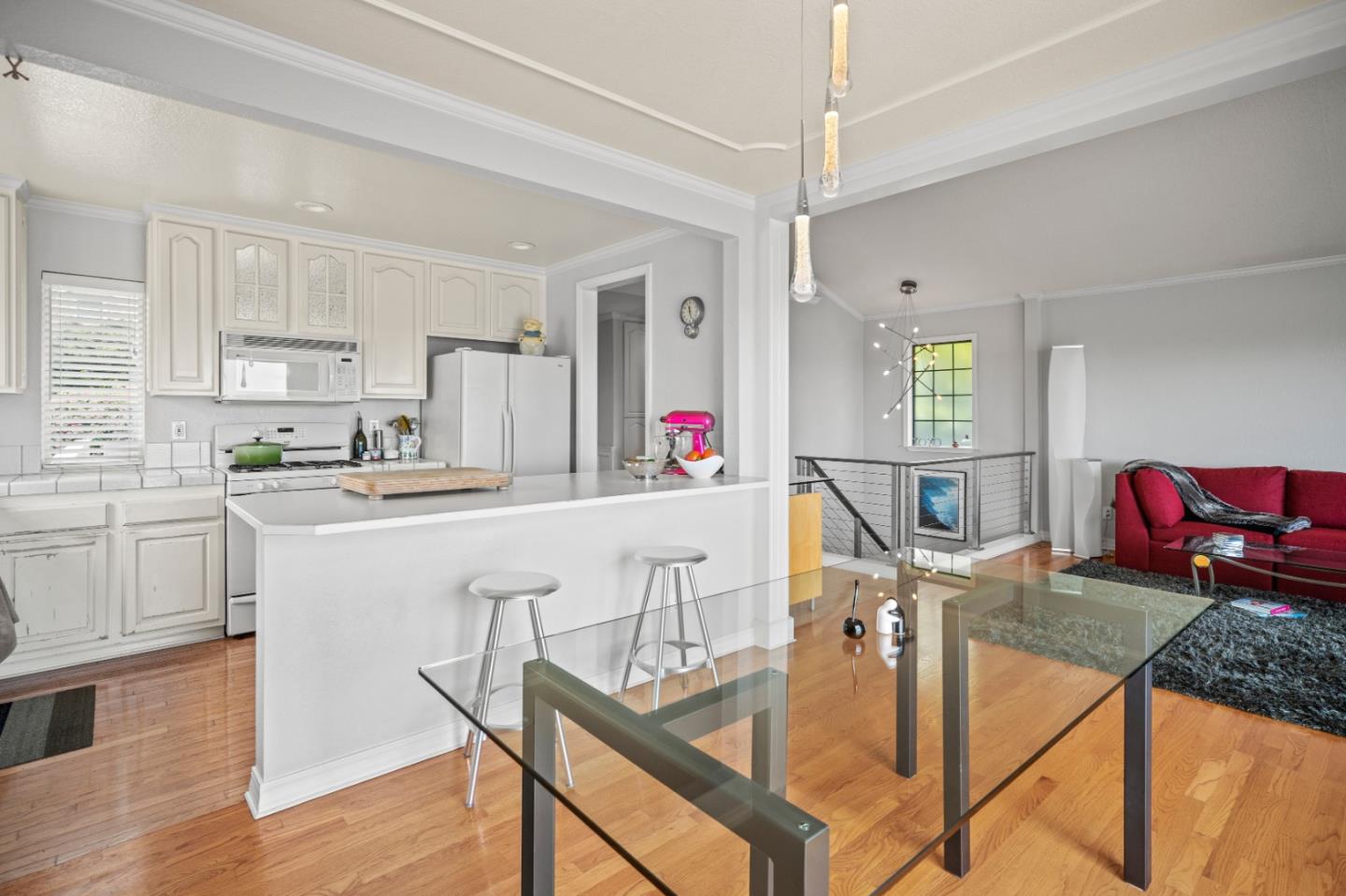 1051 Highlander Drive Seaside, CA 93955 - Photo 5 of 40 a kitchen with stainless steel appliances granite countertop a stove a sink dishwasher and white cabinets with wooden floor
