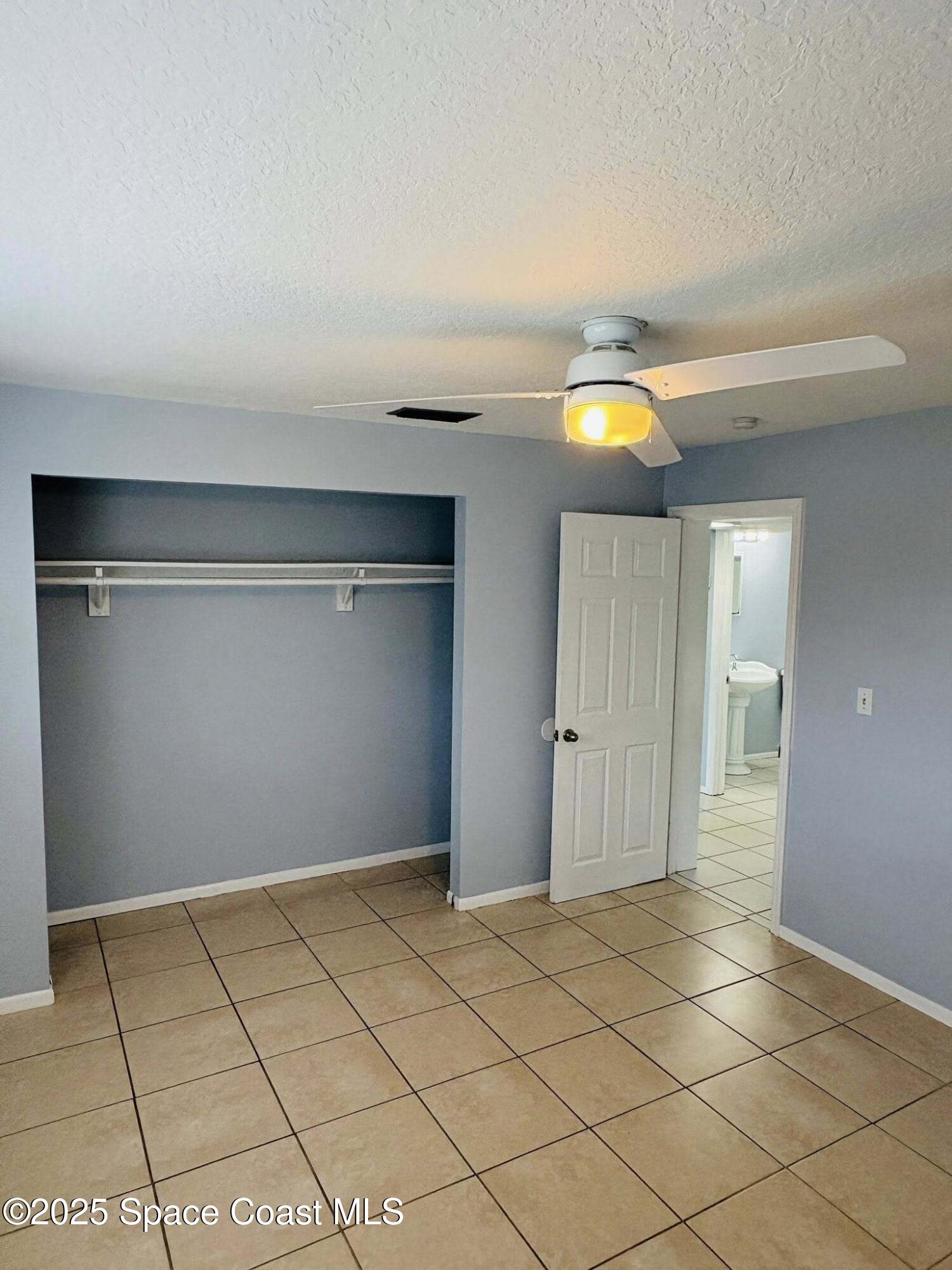 331 South Brevard Avenue, Unit B Cocoa Beach, FL 32931 - Photo 15 of 23 a view of a livingroom with an empty space and a window