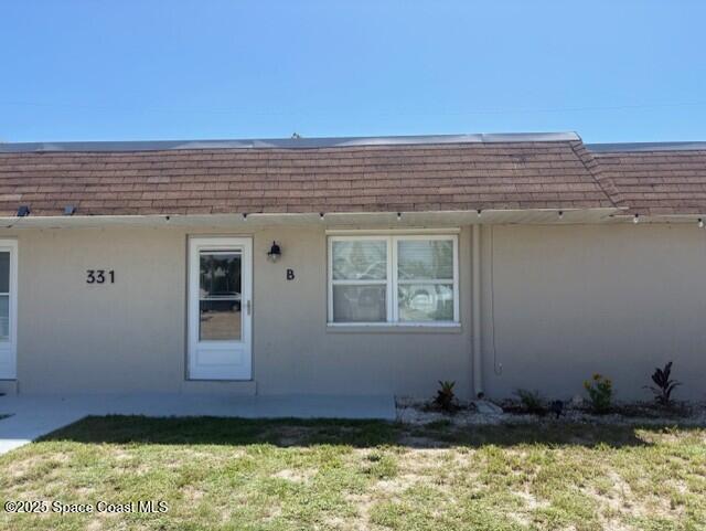331 South Brevard Avenue, Unit B Cocoa Beach, FL 32931 - Photo 21 of 23 a front view of a house