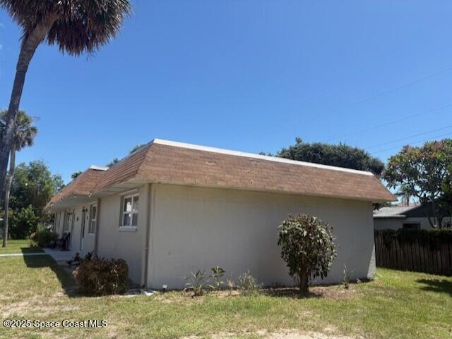 331 South Brevard Avenue, Unit B Cocoa Beach, FL 32931 - Photo 22 of 23 a front view of a house with garden