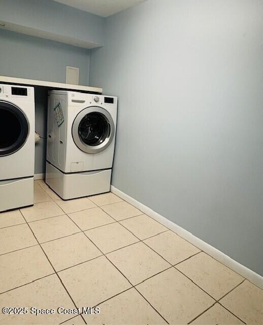 331 South Brevard Avenue, Unit B Cocoa Beach, FL 32931 - Photo 6 of 23 a utility room with dryer and washer
