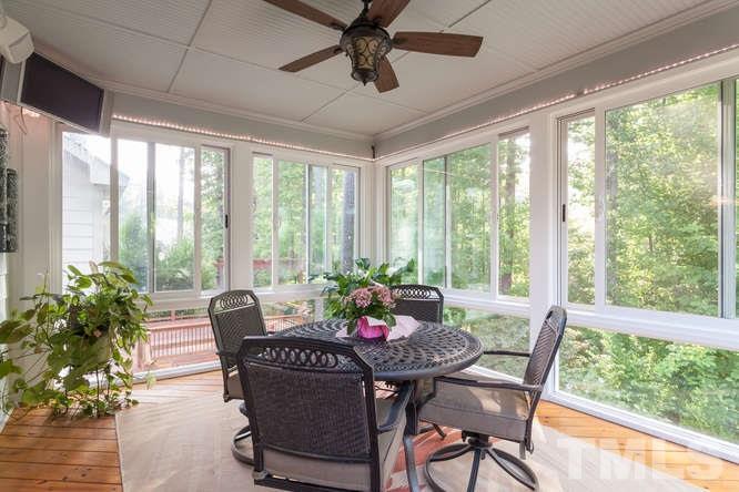 12825 Edsel Drive Raleigh, NC 27613 - Photo 22 of 25 a view of a dining room with furniture window and outside view