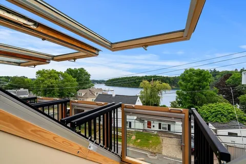 a view of a balcony with two chairs