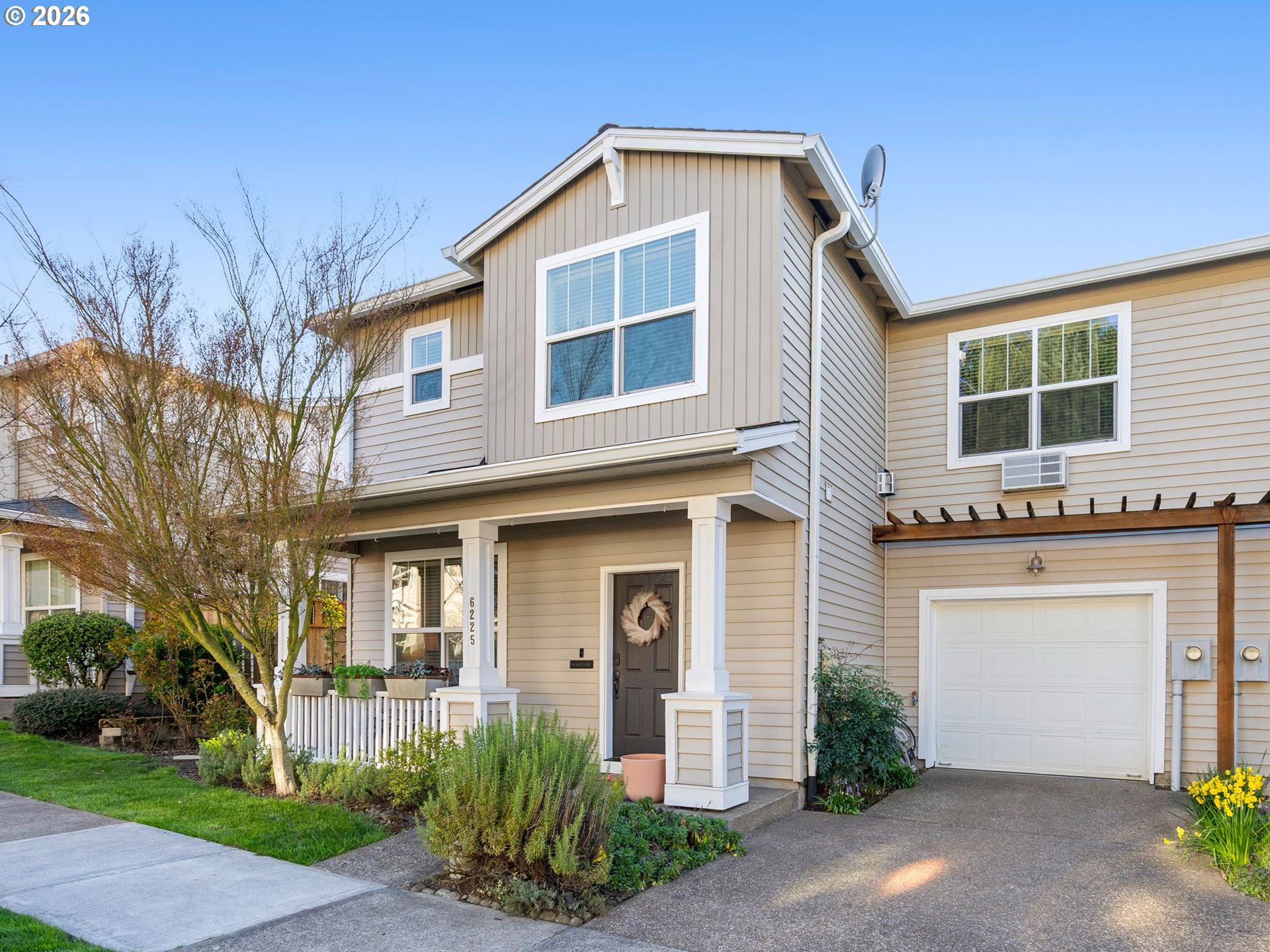 6225 Southwest 182nd Terrace Beaverton, OR 97007 - Photo 1 of 36 a front view of a house with garden