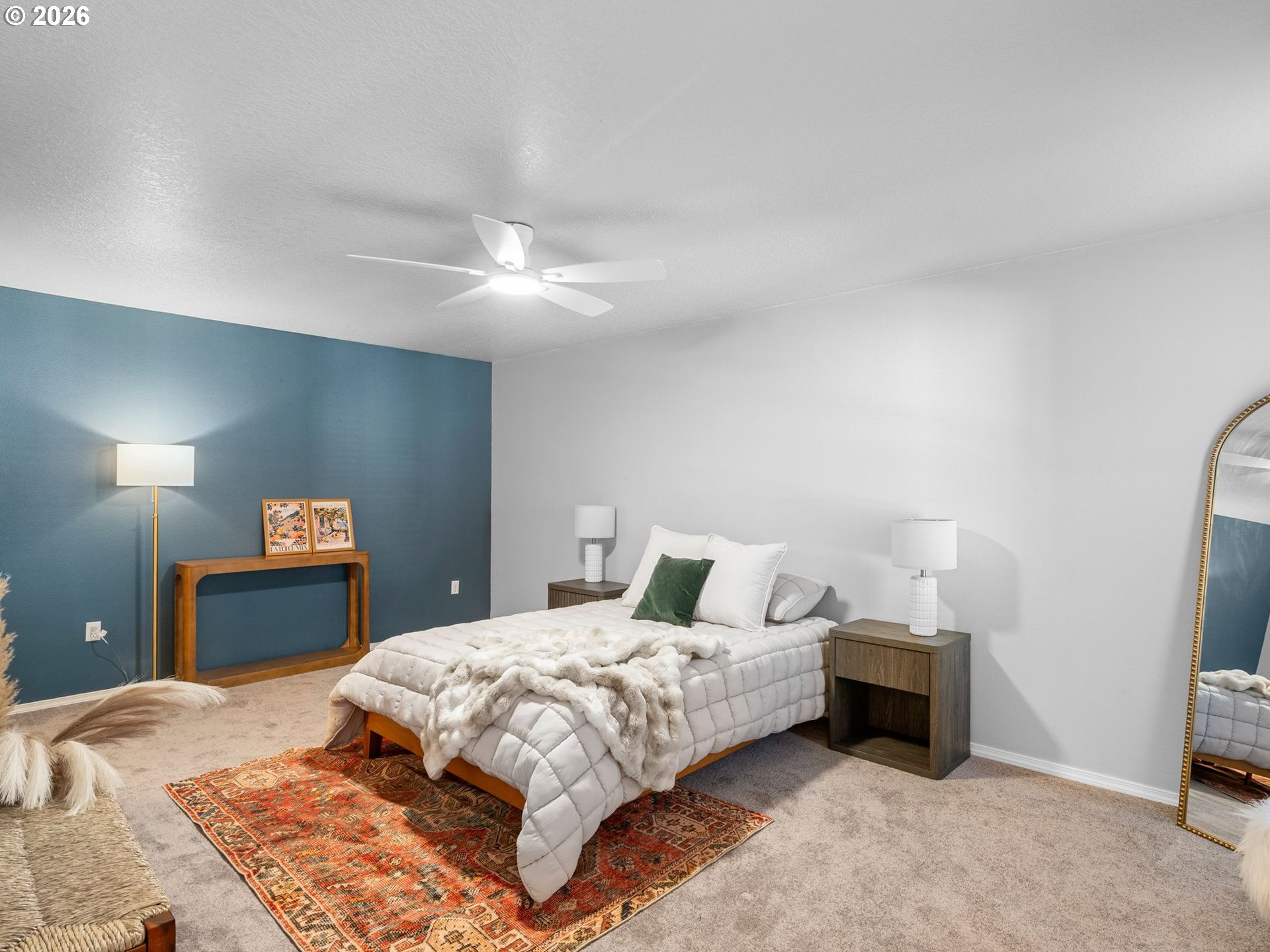 6225 Southwest 182nd Terrace Beaverton, OR 97007 - Photo 17 of 36 a bedroom with a bed and a lamp