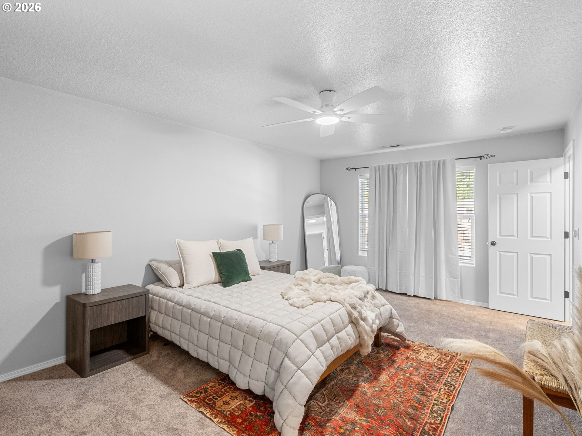 6225 Southwest 182nd Terrace Beaverton, OR 97007 - Photo 18 of 36 a bedroom with bed and a chandelier