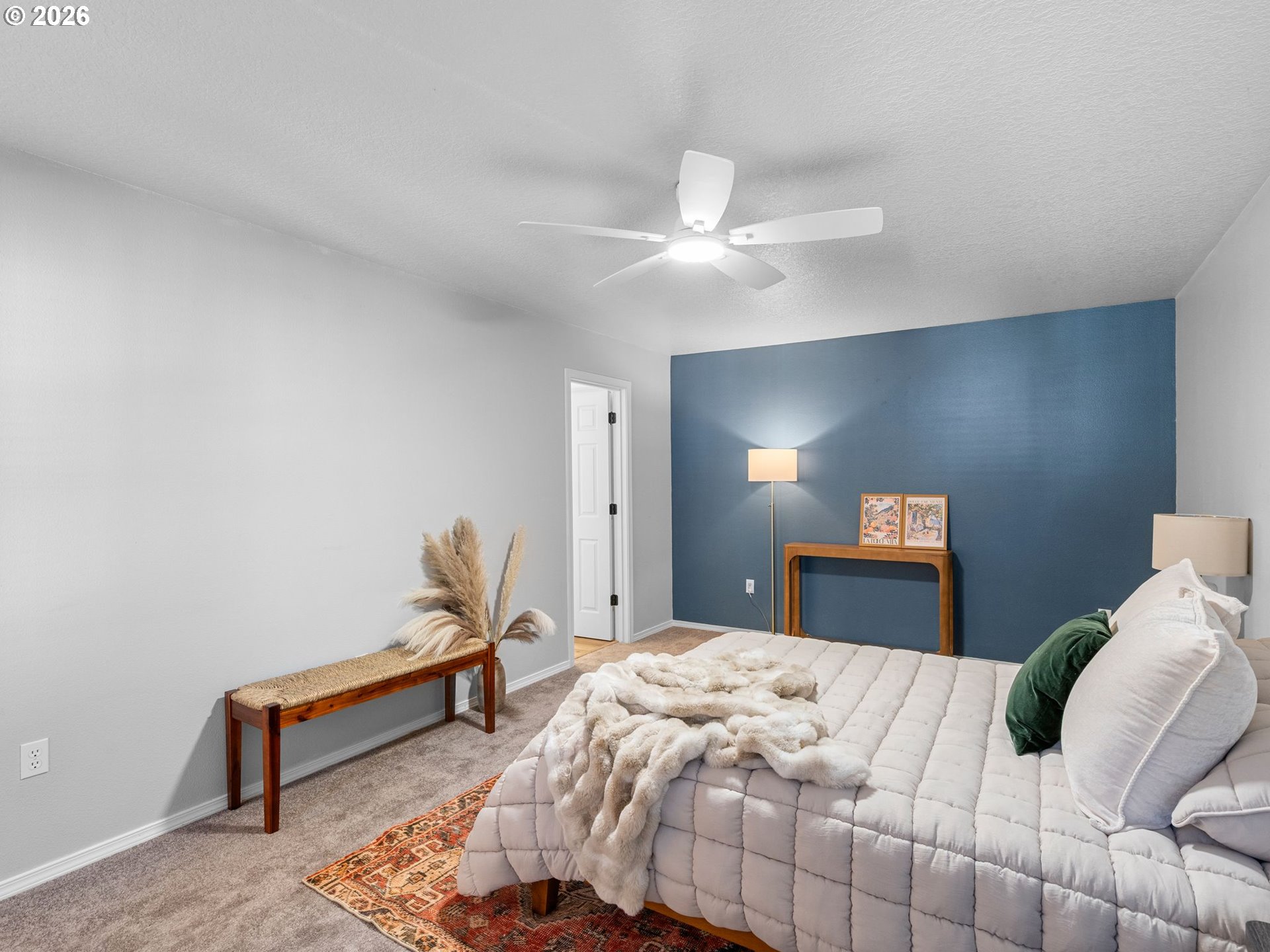 6225 Southwest 182nd Terrace Beaverton, OR 97007 - Photo 19 of 36 a bedroom with a bed and a chandelier