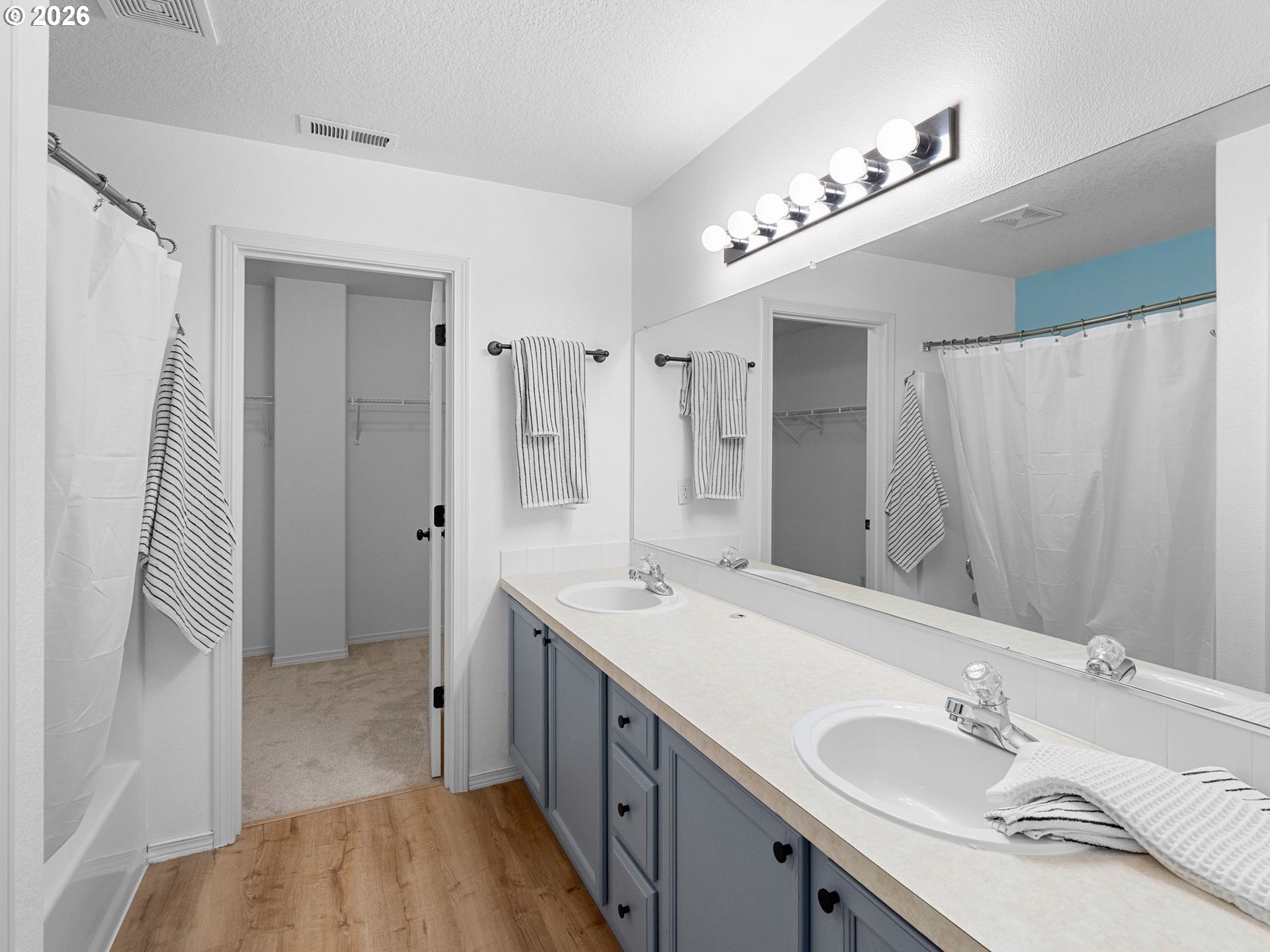 6225 Southwest 182nd Terrace Beaverton, OR 97007 - Photo 21 of 36 a bathroom with a sink double vanity granite tub and shower