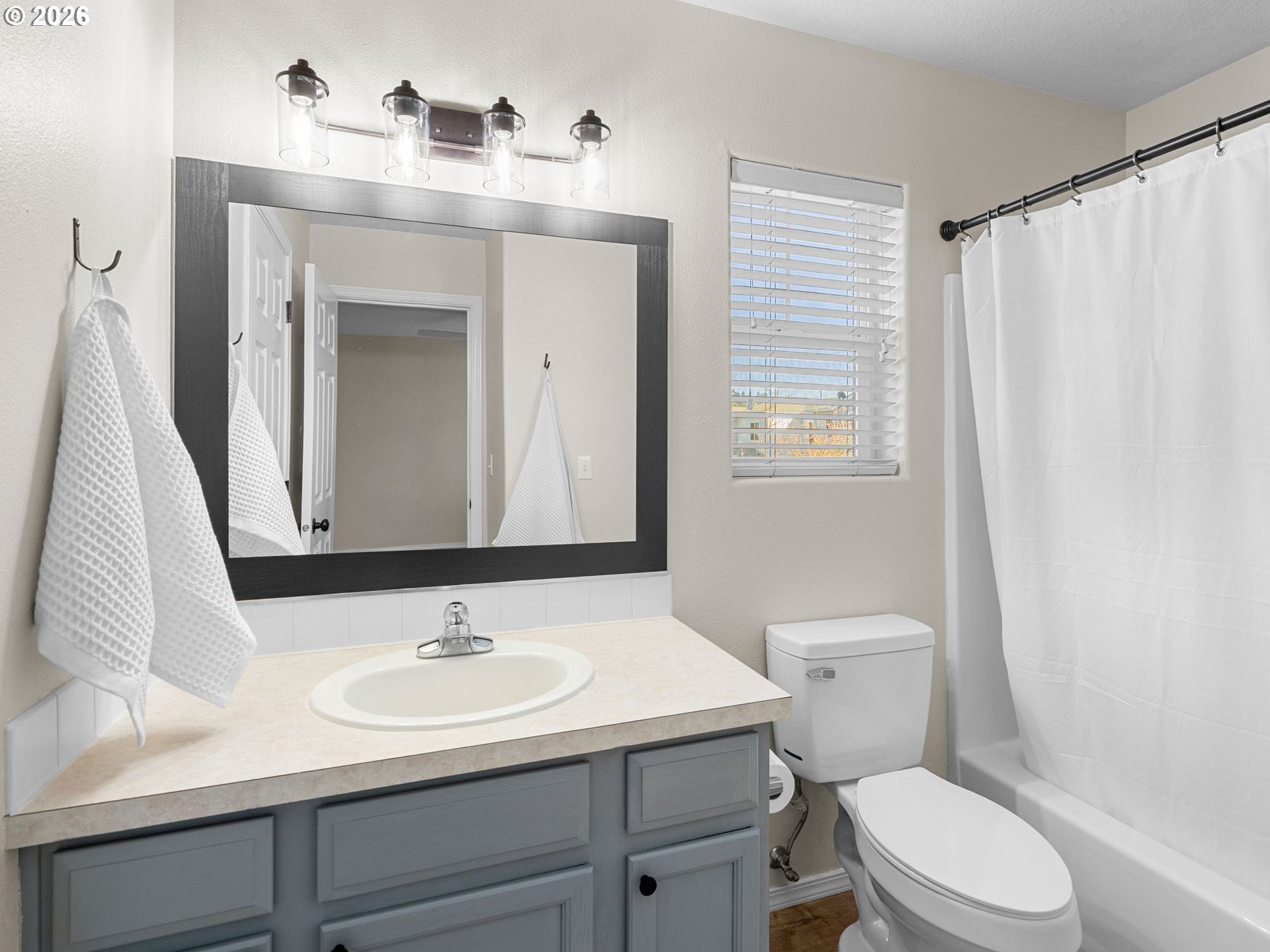 6225 Southwest 182nd Terrace Beaverton, OR 97007 - Photo 28 of 36 a bathroom with a sink toilet and mirror