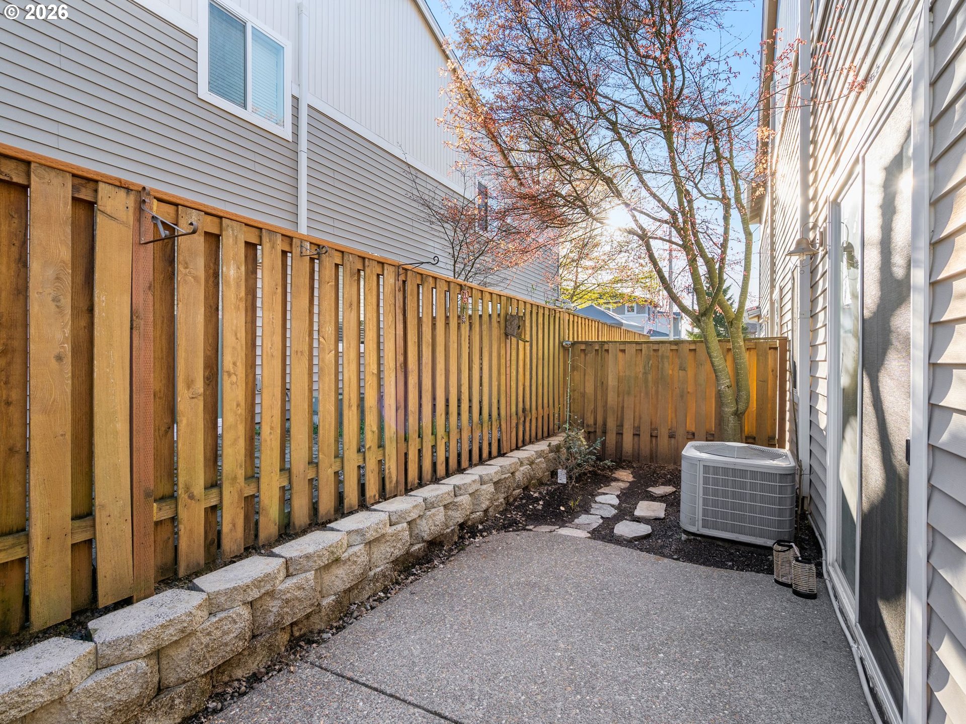 6225 Southwest 182nd Terrace Beaverton, OR 97007 - Photo 33 of 36 a view of backyard with wooden fence and large trees